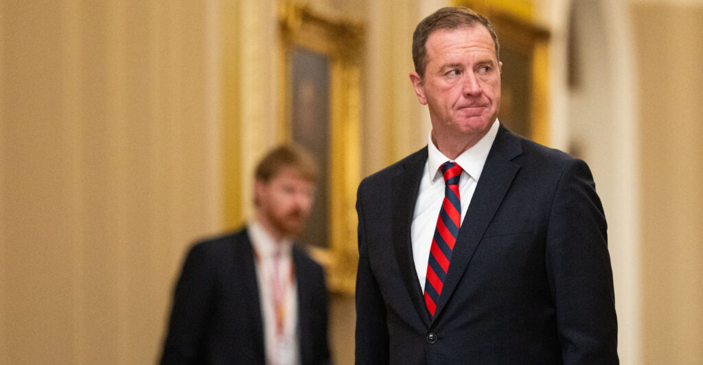 Sen. Eric Schmitt, R-Mo., stands in the corridors of Congress.