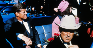 President John F Kennedy, first lady Jacqueline Kennedy, and Texas Gov. John Connally ride in a motorcade in Dallas, Texas, on the day of Kennedy's Nov. 22, 1963, assassination.