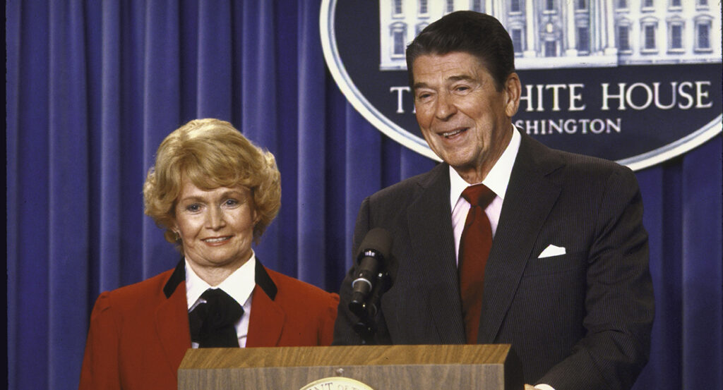 Margaret Heckler, right, stands next to Ronald Reagan at the White House.