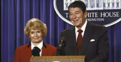 Margaret Heckler, right, stands next to Ronald Reagan at the White House.
