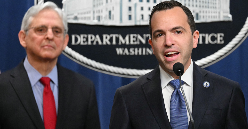 Former Attorney General Merrick Garland stands with New Jersey Attorney General Matthew Platkin.
