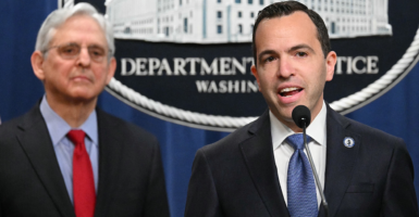 Former Attorney General Merrick Garland stands with New Jersey Attorney General Matthew Platkin.