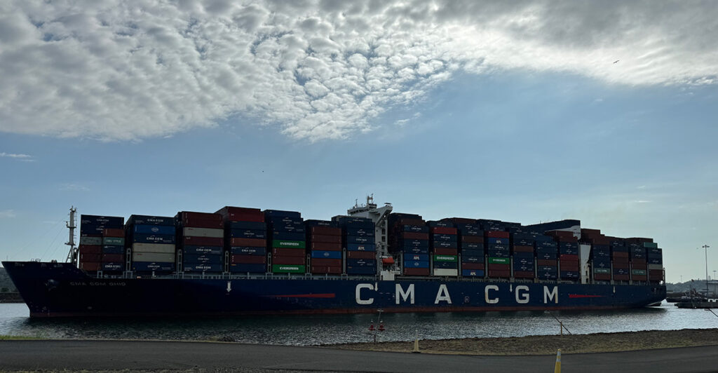A large cargo ship moves through the Panama Canal.