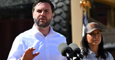 Vice President JD Vance speaks to reporters as Director of National Intelligence Tulsi Gabbard looks on during a visit to the U.S.-Mexico border in Eagle Pass, Texas, on Wednesday.
