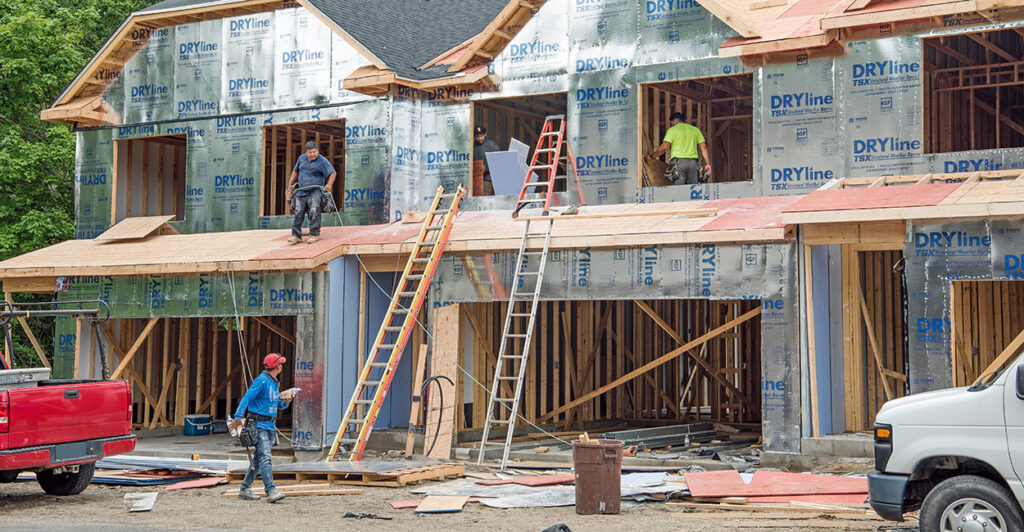 Migrant construction workers build the second story of new condo housing development in Dayton, Ohio, on June 26, 2024.