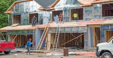 Migrant construction workers build the second story of new condo housing development in Dayton, Ohio, on June 26, 2024.