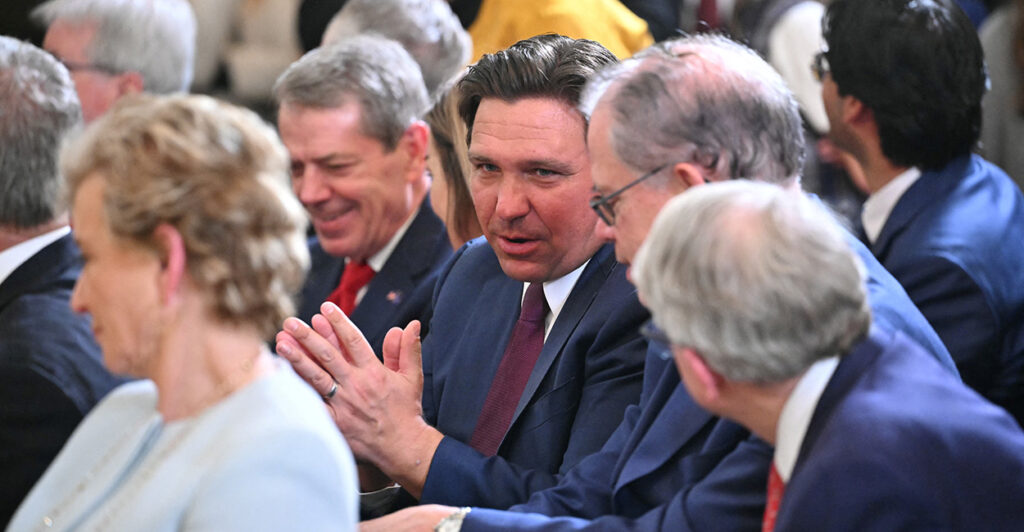 Florida Gov. Ron DeSantis attends an executive order signing by President Donald Trump on Thursday.