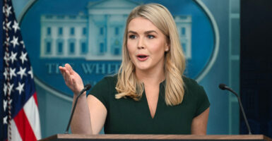 White House Press Secretary Karoline Leavitt speaks at the podium with the White House signage behind her.