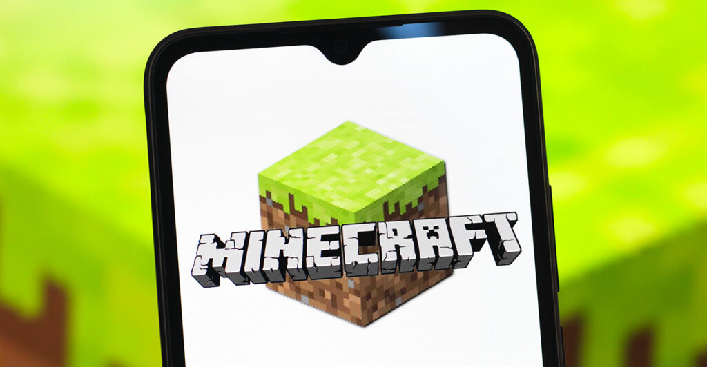 The video game Minecraft, displayed on a handheld device