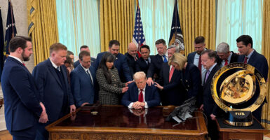 Christian leaders pray over President Donald Trump in the Oval Office on Wednesday.