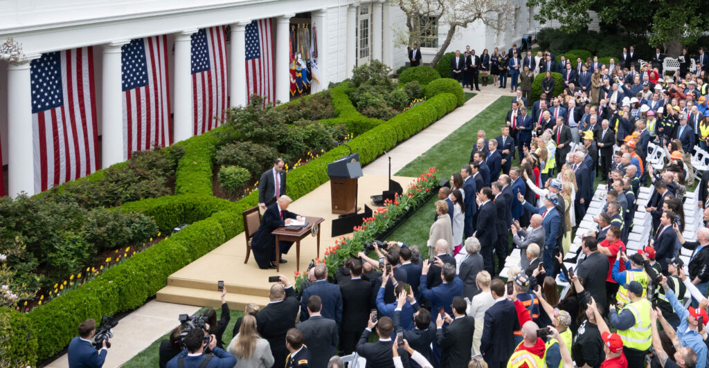 President Donald Trump signs an executive order after delivering remarks on reciprocal tariffs at a "Make America Wealthy Again" event in the Rose Garden of the White House on Wednesday.