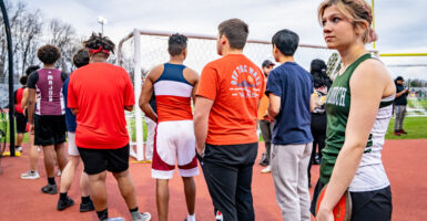 Transgender athlete Eliza Munshi waits in line to discus throw in the men's division of a districtwide track meet in Falls Church, Virginia, on March 19.