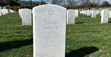 The new tombstone for Army Pvt. David Moser, with a Star of David, at Arlington National Cemetery