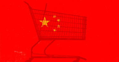 An illustration of a silhouette of a shopping cart against a backdrop of a Chinese flag.