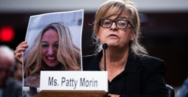 Patty Morin holds a picture of her daughter, Rachel Morin—who was killed by an illegal immigrant in Maryland in August 2023—at a Senate Judiciary Committee hearing on Dec. 10. He was convicted Monday.