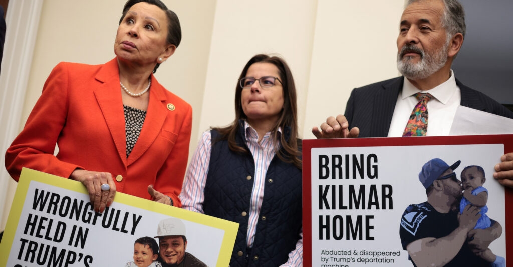 Democrat Reps. Nydia Velazquez of New York and Juan Vargas of California display posters of Kilmar Armando Abrego Garcia at an April 9 news conference about the illegal alien's arrest and deportation to his native El Salvador.