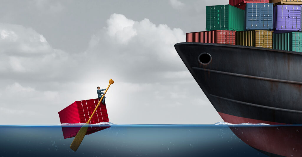 An abstract illustration of the U.S. trade deficit as a freight liner transporting huge cargo contrasted with one businessman rowing a single container in the ocean, as a metaphor for an economic imbalance.