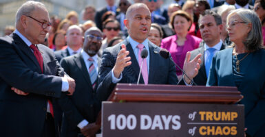 As Senate Minority Leader Chuck Schumer (left) looks on, fellow New York Democrat House Minority Leader Hakeem Jeffries rails against the first 100 days of the Trump administration at a news conference outside the Capitol.