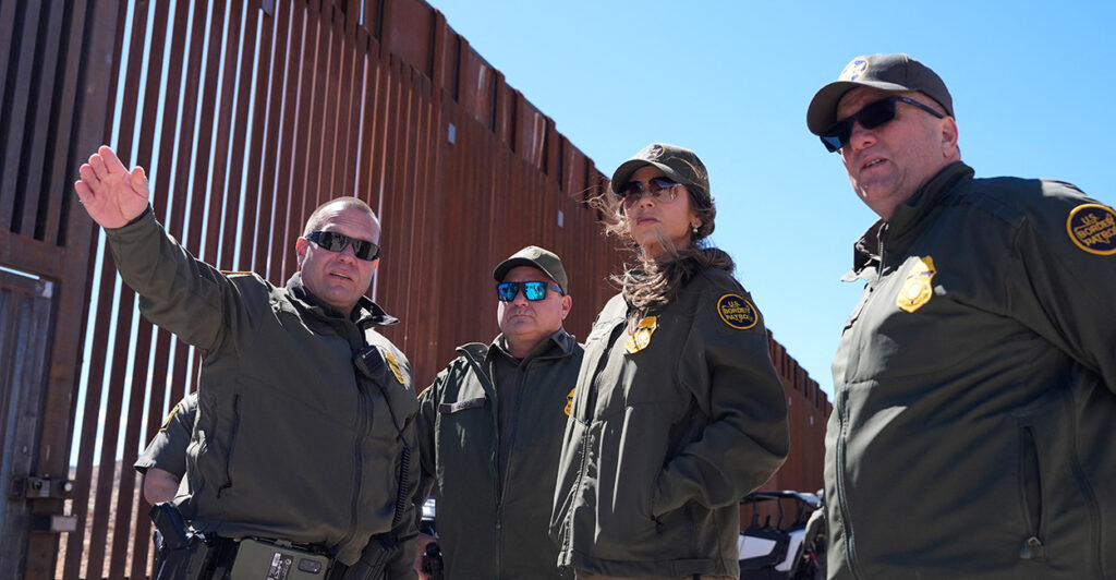 Homeland Security Secretary Kristi Noem listens during a tour along the Nogales border wall at the Mariposa Port of Entry in Nogales, Arizona, on March 15.