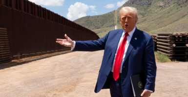 Then-presidential candidate Donald Trump walks along the U.S.-Mexico border south of Sierra Vista, Ariz., on Aug. 22, 2024.
