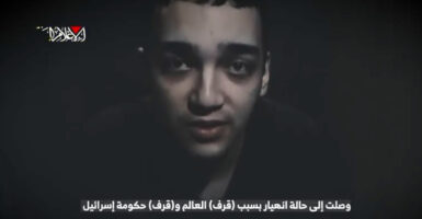 A screen grab of a video released by Hamas of American Edan Alexander. The image depicts a headshot of the haggard 21-year-old as he speaks directly into the camera.