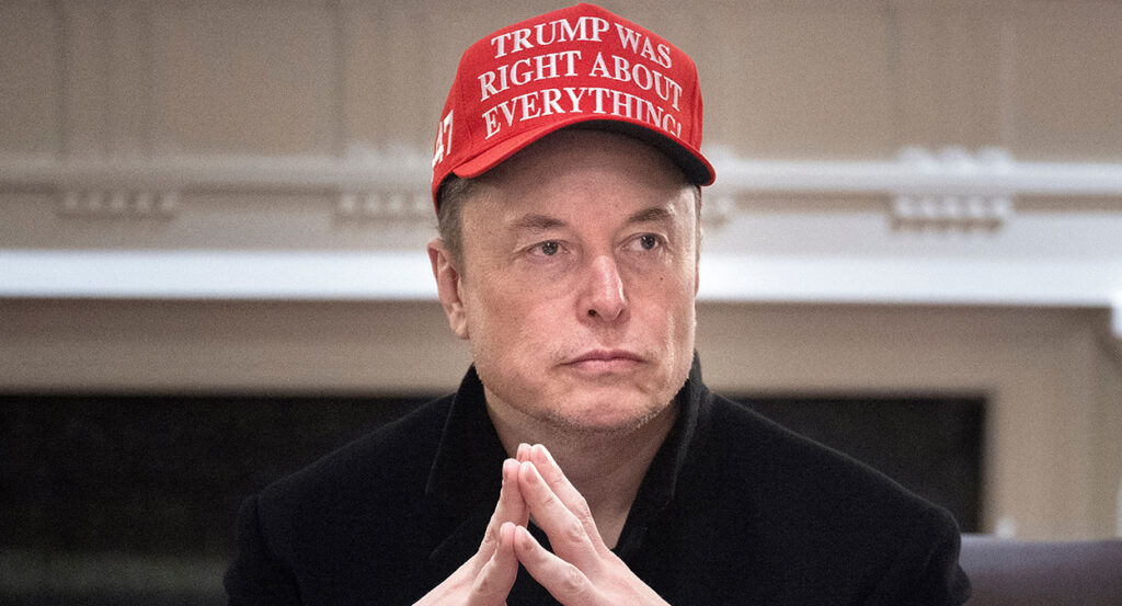 Elon Musk in black wears a red hat reading "Trump was right about everything"