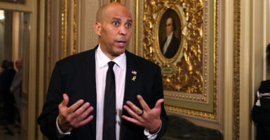 Sen. Cory Booker, D-N.J., speaks to reporters after delivering a record-long floor speech on March 31 and April 1.
