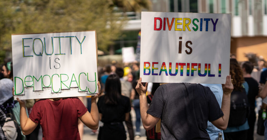 Students at the University of South Florida, Tampa hold signs such as "Diversity is Beautiful" to protest Gov. Ron DeSantis's crackdown on DEI at the state's colleges and universities.