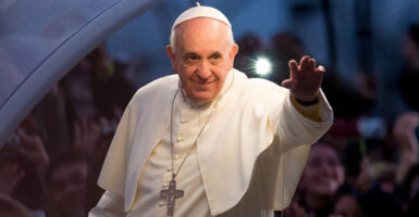Pope Francis waving.