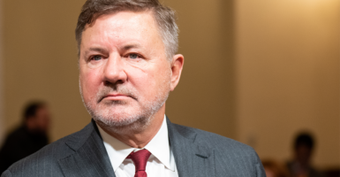 Oklahoma Attorney General Gentner Drummond In a gray suit and red tie