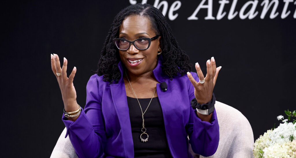 Ketanji Brown Jackson in a black dress with a blue jacket