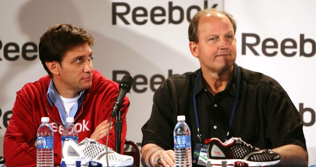 Don Hasselbeck speaks at a Reebok event in 2009 with Mike Greenberg looking on.