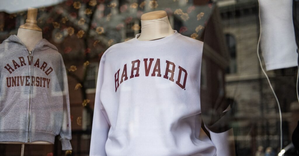 Harvard sweatshirts are displayed for sale in a school store window on the Harvard University campus.