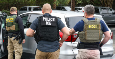 ICE officers, with assistance from Homeland Security Investigations and Border Patrol, perform enforcement operations in Delray Beach, Fla., on. Jan. 23.