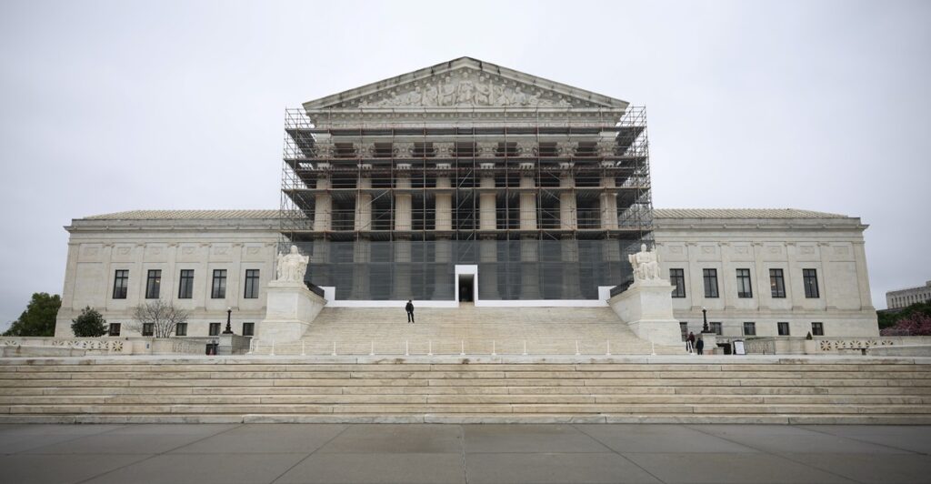 The front steps and entrance to the U.S. Supreme Court building is shown.