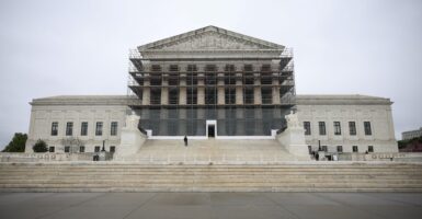 The front steps and entrance to the U.S. Supreme Court building is shown.