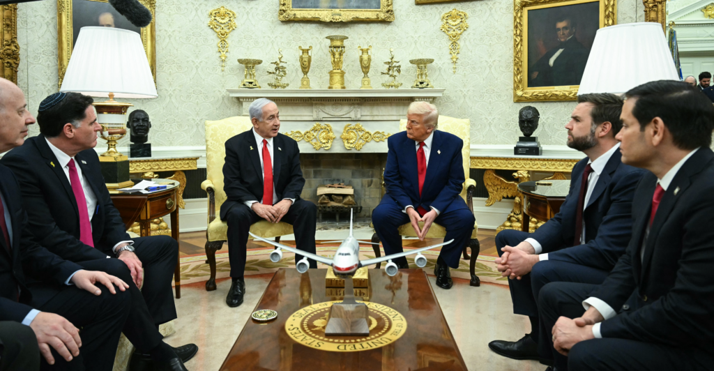 President Donald Trump confers with Israeli Prime Minister Benjamin Netanyahu at the White House on April 7.