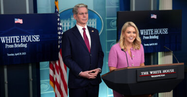 Treasury Secretary Scott Bessent and White House press secretary Karoline Leavitt stand at the podium speaking to the media in the White House press room