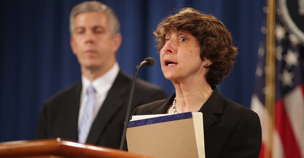 Jocelyn Samuels holds a news conference at the Justice Department on May 13, 2014.