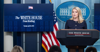 White House press secretary Karoline Leavitt speaks from behind a lectern at her daily briefing Tuesday.