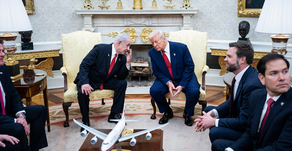 President Donald Trump and Israeli Prime Minister Benjamin Netanyahu lean towards each other in conversation during an Oval Office meeting April 7.