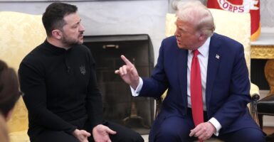 Donald Trump holds up his hand as he scolds Volodymyr Zelenskyy in a meeting.