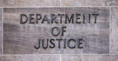 the Department of Justice sign on the stone façade of the Department of Justice building