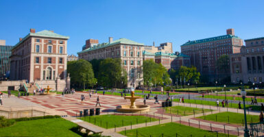 A wide-angle view of Columbia University against a clear blue sky.