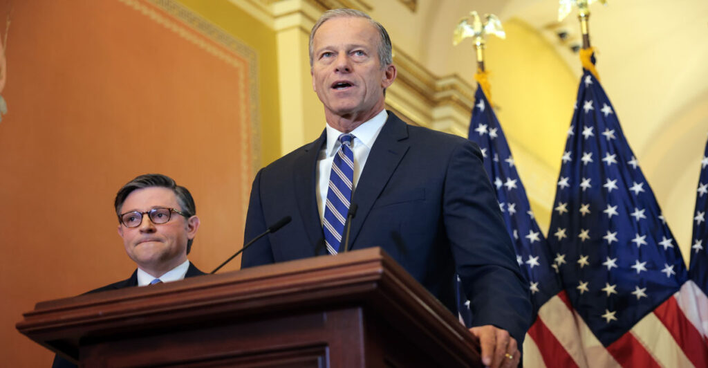Senate Majority Leader John Thune at a podium in the U.S. Capitol Building, with Speaker Mike Johnson at his side.
