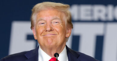 Close-up of Donald Trump grinning.