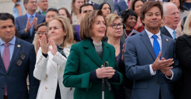 Rep. Shri Thanedar, D-Mich. (right), joins Rep. Nancy Pelosi, D-Calif. (center), and other Democrats at a press conference outside of the Capitol on Feb. 25.