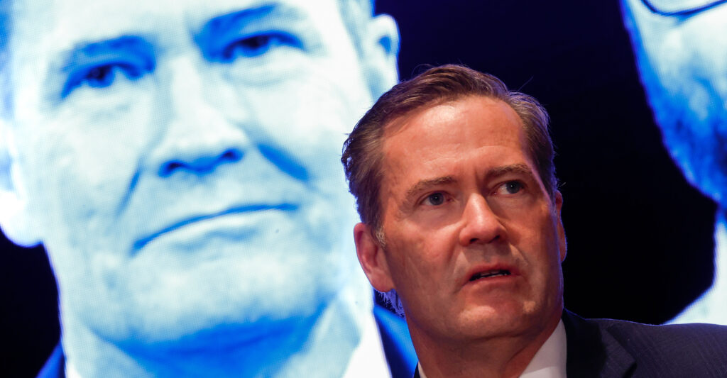 Michael Waltz, then still national security adviser, speaks at the Capitol on Wednesday, with an image of himself on a screen behind him.