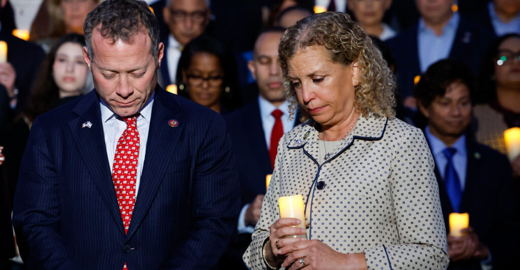 Reps. Josh Gottheimer, D-N.J., and Debbie Wasserman Schultz, D-Fla., participate in a vigil for Israel on the steps of the Capitol on Oct. 12, 2023, in the wake of Hamas' attack on Israel five days earlier.