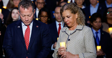 Reps. Josh Gottheimer, D-N.J., and Debbie Wasserman Schultz, D-Fla., participate in a vigil for Israel on the steps of the Capitol on Oct. 12, 2023, in the wake of Hamas' attack on Israel five days earlier.